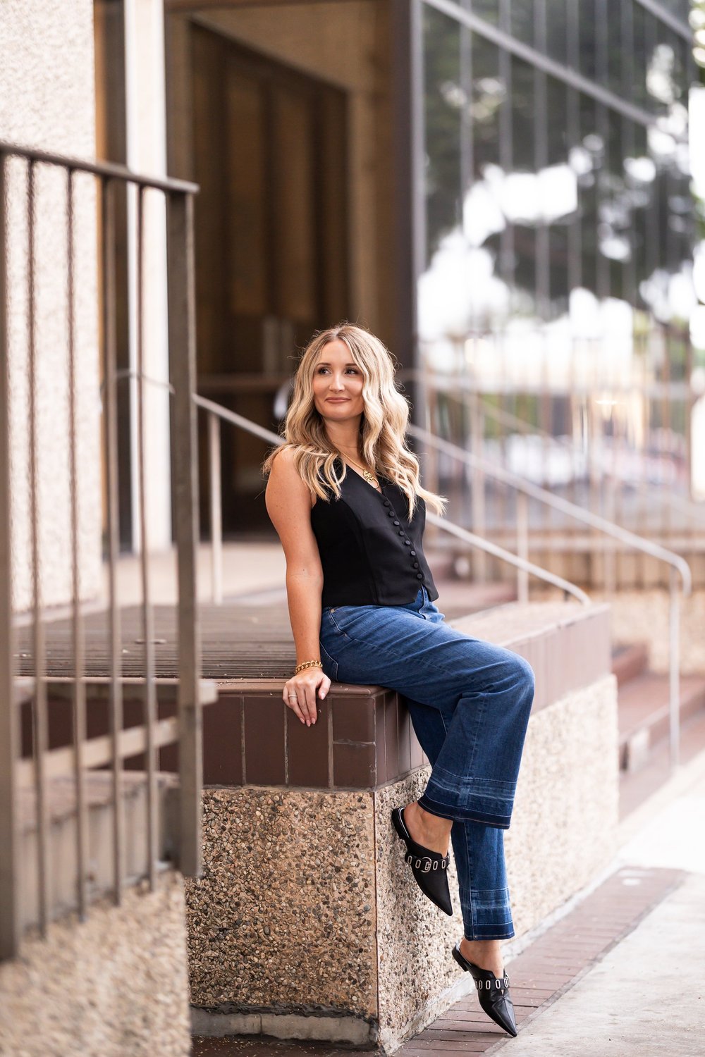 Lauren Fyfe seated outside a modern building in San Diego